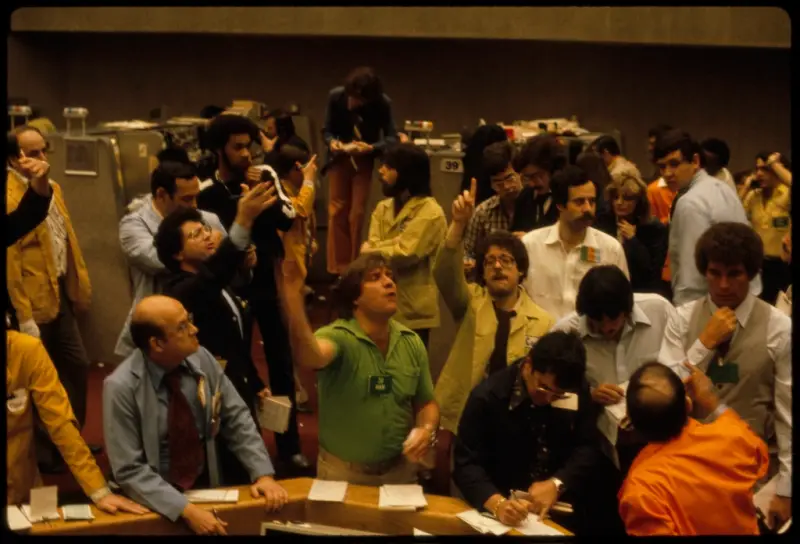 Traders at work on a stock exchange trading floor.